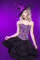 Beautiful woman, blonde in a good witch costume on a purple background. Costume party, young girl....