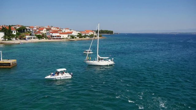 PREKO, CROATIA, 12.8.2017: Boats waiting for their turn for filling up fuel. Slow-motion-hd.