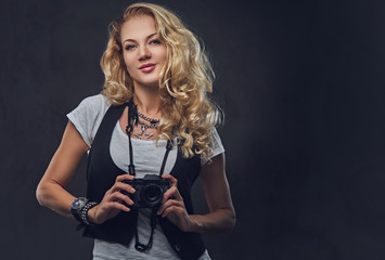 Female photographer taking pictures with a compact camera.