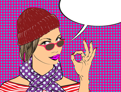 Beauty girl with speech bubble.Pop Art girl. The girl in a hat and scarf.