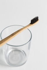 Wooden toothbrush on a glass