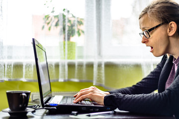 Business woman using computer in the office, concept of people working in stress