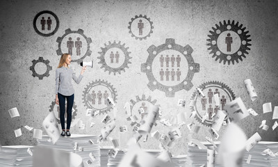 Woman standing with megaphone.