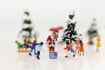 Miniature Santa Claus and Snow man make happy hour for children on Christmas day