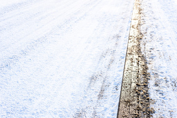 Background with snow on road in winter and walkway, texture