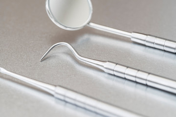 Close Up Of Dental Instruments On Metal Surface