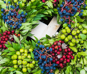 autumn wreath with berries rose hip, hawthorn and rowan berry