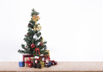 Christmas tree with decorations gift box for Merry Christmas and Happy New Year 2018 on table.