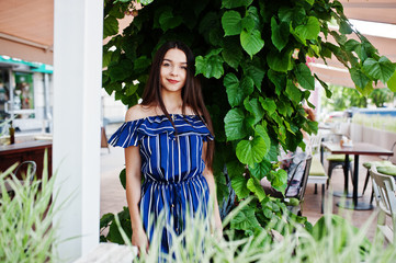Gorgeous brunette girl portrait in cafe.