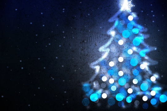 Winter holiday background with blue Christmas tree from lights