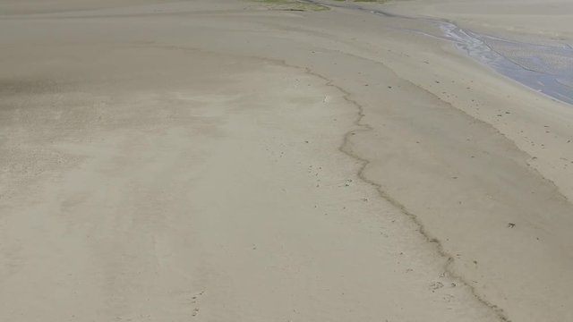 A Fast Pullback Aerial Shot of Fairbourne Estuary