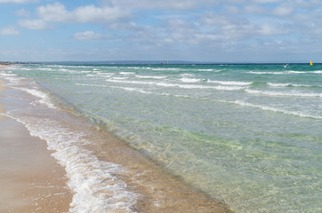 Water and sand at Aspendale Beach in Melbourne, Australia