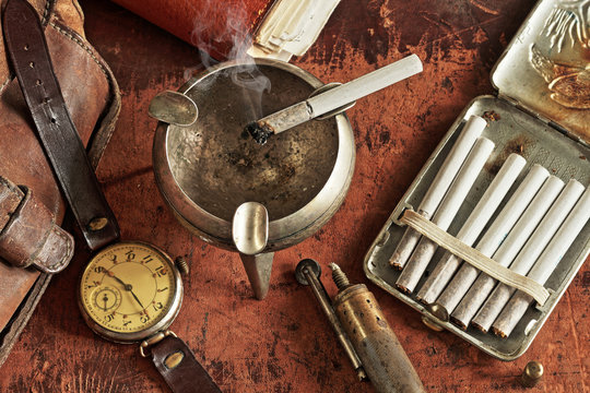 Composition with clock and cigarettes in a retro style