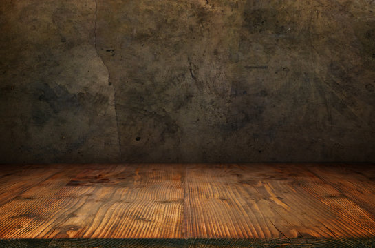 Old concrete wall with wooden floor