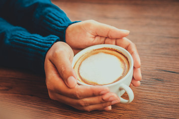 hand holding coffee cup