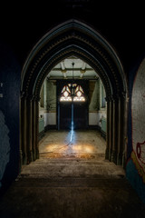 Fototapeta na wymiar Arched Entry and Front Door with Stained Glass Transom - Abandoned Church - New York
