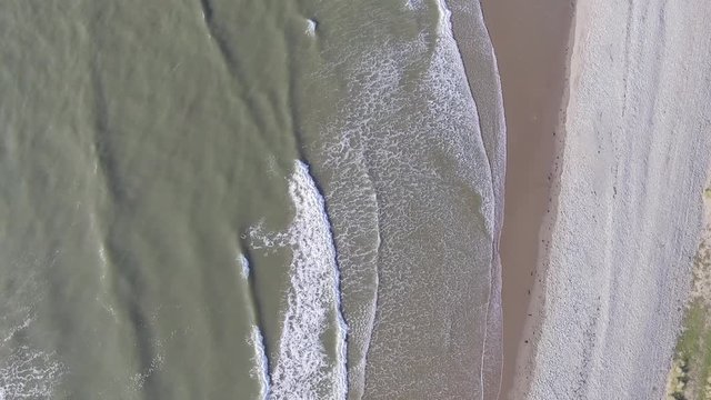 A Downward Static Aerial Shot of Waves at Fairbourne Beach