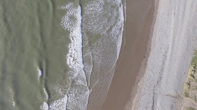 A Downward Aerial Shot of Waves at Fairbourne Beach