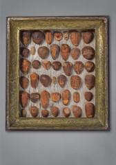 Collage Of Hand Carved Avocado Stone Faces