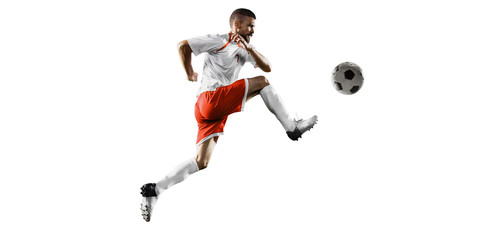 Soccer player performs an action play and beats the ball. Isolated football player in unbranded...