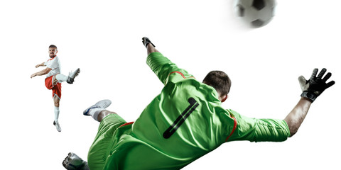 Soccer player performs an action play and beats the ball. The football goalkeeper catches the ball. Isolated football player and goalkeeper in unbranded uniform on a white background. © Alex