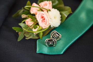 Tie,  silver cufflinks and boutonniere  for wedding