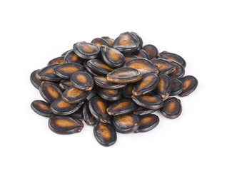 Macro group of watermelon seeds on white background.