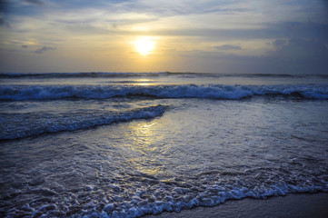 Amazing beautiful sea landscape sunset view of Seminyak Double Six beach in Bali island of Indonesia