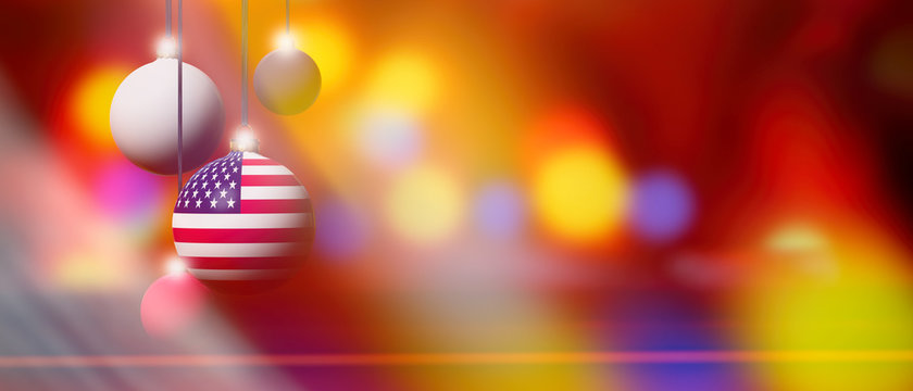 United States flag on Christmas ball with blurred and abstract background.