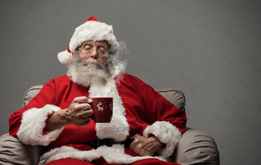 Santa Claus having an hot drink