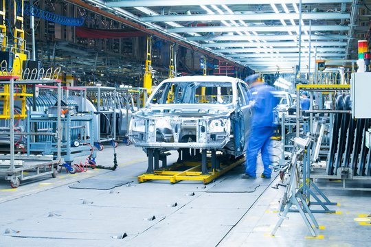 car production line, workers are working.