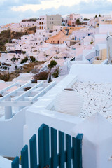 Oia town on Santorini island, Greece. Traditional and famous white and rose  houses at sunny day