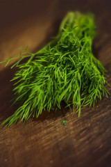 green dill on cutting desk soft focus