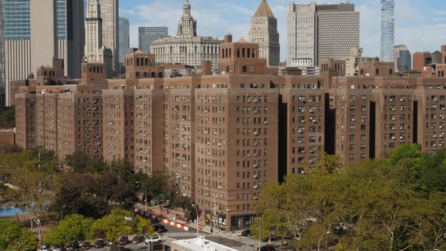 A daytime sunny exterior establishing shot (DX) of typical red brick apartment buildings in the Two Bridges neighborhood in midtown Manhattan.  	