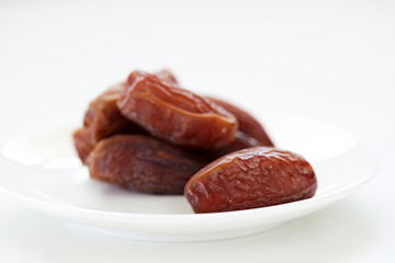 Dried Dates Fruits on dish white background