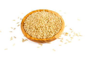 brown rice in a olive wood bowl isolated on white