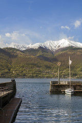 lake port with snowy mountains