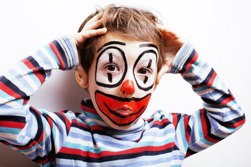 little cute boy with facepaint like clown, pantomimic expression