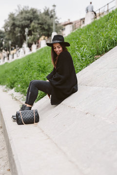 Beutiful brunette in the city in autumn