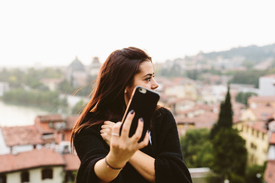 Beutiful brunette in the city in autumn