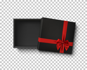 Opened black empty gift box with red ribbon.
