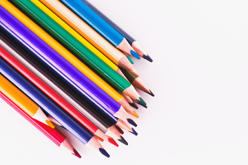 Color pencils on white background. Different colored pencils