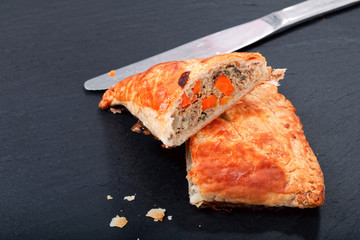 Food concept Fresh bake Homemade meal beefs or chicken triangle puff pie on slate stone with copy space