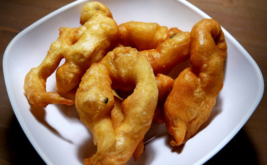 Crispy Fried Chinese Bread Sticks in White Bowl