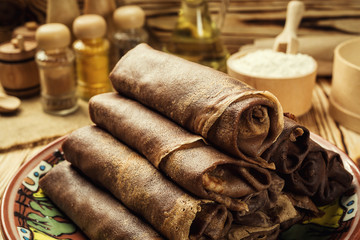 Stack of chocolate pancakes,Breakfast,snacks.Pancakes Day.Stack of kefir (buttermilk)chocolate pancakes,Pancakes with curd and raisins,Food photography.Breakfast for the whole family.With copy space