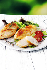Grilled Chicken Breast with Salad and cherry tomatoes.