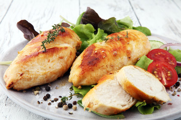 Grilled Chicken Breast with Salad and cherry tomatoes.