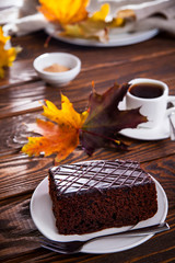 Chocolate brownie with a cup of coffee and autumn mood