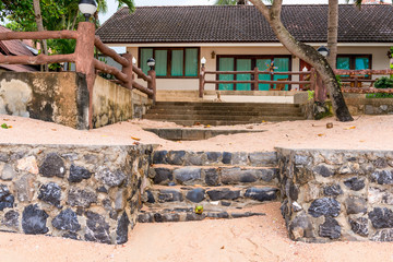 Fototapeta na wymiar house near the sea on a sandy beach