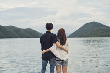 Back view of Young couple looking at the nature